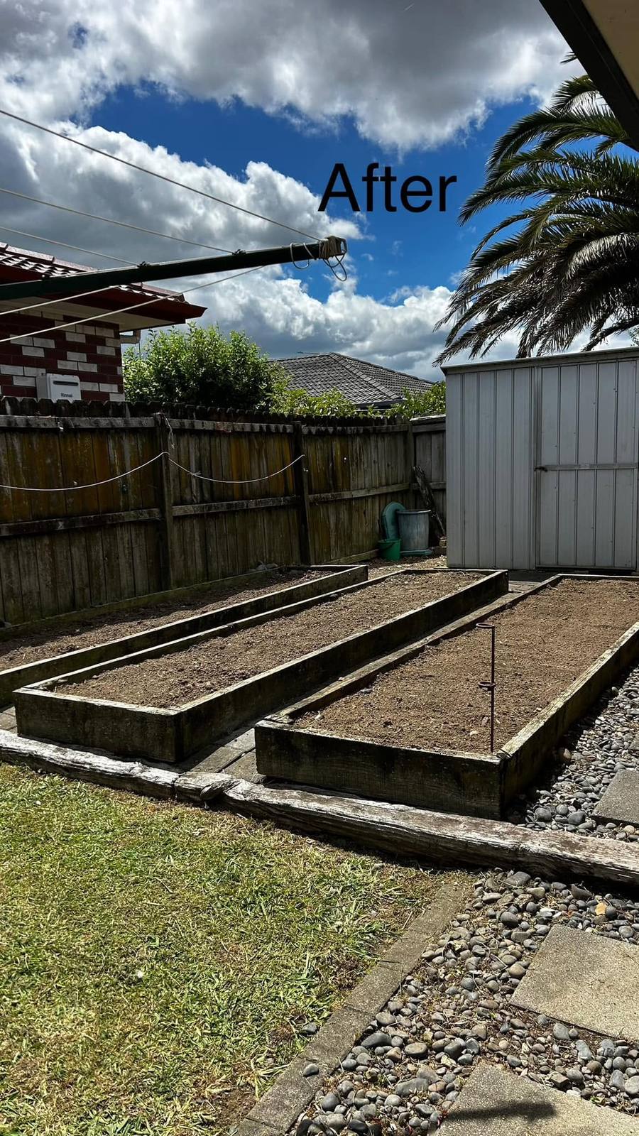 After: cleared and levelled raised garden beds ready for planting